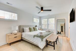 a bedroom with a bed and a dresser and a mirror at Luxe Wilmington Home 2 Mi to Historic Downtown in Wilmington