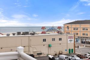 a view from a balcony of a building and the ocean at Beachview OC 2 Ocean Block in Ocean City