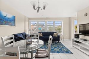a living room with a glass table and a couch at Beachview OC 2 Ocean Block in Ocean City