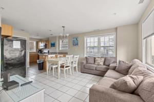 a living room with a couch and a table at Beachview OC 4 in Ocean City