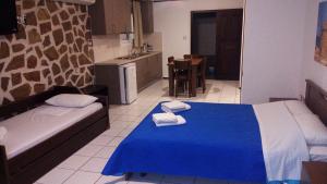 Кровать или кровати в номере Amimaya Apartments