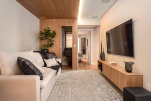 TV a/nebo společenská místnost v ubytování Luxo a Beira-Mar, 4 Suites, Jacuzzi e Sofisticaçao