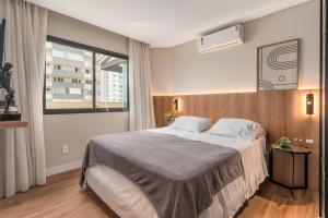 Postel nebo postele na pokoji v ubytování Luxo a Beira-Mar, 4 Suites, Jacuzzi e Sofisticaçao + 13 fotografií