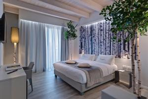 Postel nebo postele na pokoji v ubytování Hotel Locanda Al Piave ***S + 37 fotografií