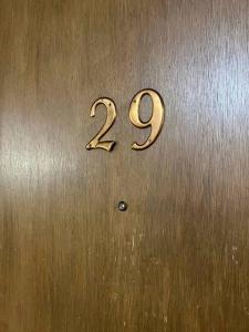 uma porta de metal com o número nela em Liberty Valley Short Term Rental - 29 em Madison