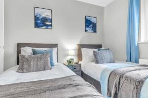 3 Bedroom Delight, free parking tesisinde bir odada yatak veya yataklar