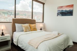 Sky Suites - Stunning Location with a great view of La Paz客房内的一张或多张床位