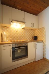 Kuchyň nebo kuchyňský kout v ubytování Gästehaus Lienharterhof