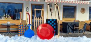 a group of skis and other equipment in the snow at Haus Luise in Bad Hindelang