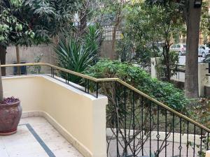 a stairway with a railing and some plants at Zamalek Garden villa-Abu El Feda in Cairo