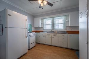 a kitchen with white appliances and a white refrigerator at Boardwalk1009-6 in Ocean City