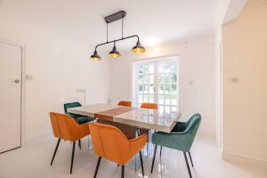 a dining room with a table and chairs at Royal Windsor Mansion Private 5 Acre Luxury Escape in Windsor