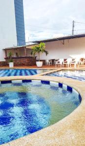 a swimming pool on the roof of a building at Hotel Fenix in Cúcuta