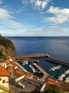 an aerial view of a marina with boats in the water at Mirando al mar, itxas gane in Elanchove