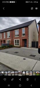 a brick building with a driveway in front of it at Attic Room in Citywest in Dublin