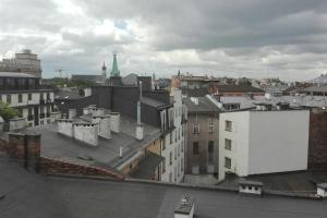 a view of a city with buildings and a white billboard at Z widokiem- Old Town in Kraków