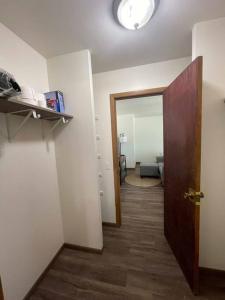 an empty room with a door and a room with a bedroom at Liberty Valley Short Term Rental - 27 in Madison