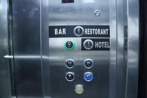 a close up of an elevator with a bar and restaurant buttons at Sky View Hotel & Restaurant in Kukës