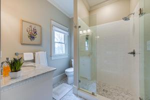 a bathroom with a shower and a toilet at Spacious Salem-Winston Home with Deck! in Winston-Salem +22 photos