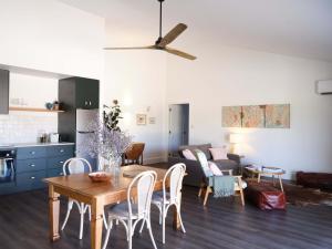 a living room with a table and a couch at Shawwood Estate in Mudgee