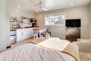 a bedroom with a bed and a kitchen at Quiet and Convenient Reno Studio Less Than 2 Mi to Downtown! in Reno