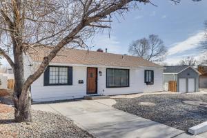 a white house with a tree in front of it at Quiet and Convenient Reno Studio Less Than 2 Mi to Downtown! in Reno