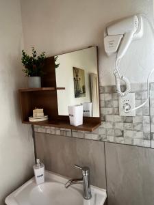 a bathroom with a sink and a mirror at Recodo de mar in Aguas Dulces +24 photos