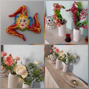 a group of four pictures of vases with flowers in them at Casa Irene in Catania