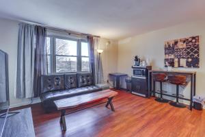 a living room with a bench in front of a window at Cozy Easton Condo Near Historic Downtown in Easton