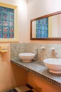 two sinks on a counter in a bathroom at Vihara - Spa, Yoga, Wellness & Events in Antigua Guatemala