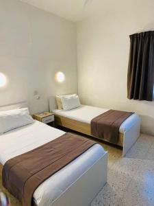 Katil atau katil-katil dalam bilik di SunnyGem Retreat