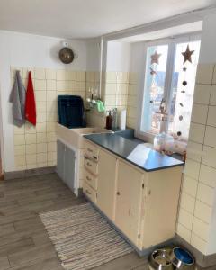 a kitchen with a sink and a window at LaTerestone 