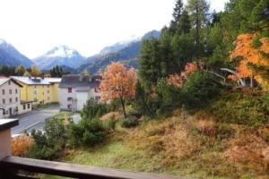a view from a balcony of a town with trees at Apparthotel Pöstli Nr 303 - b48497 in Maloja