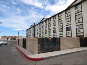 a building with a red curb in front of a street at Longhorn Boulder Highway in Las Vegas