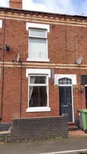 a brick building with a window and a door at Holiday Home in Kidderminster in Kidderminster