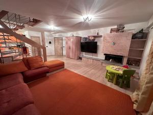 a living room with a couch and a table at CAMPIGLIO Panorama sul Brenta in Madonna di Campiglio