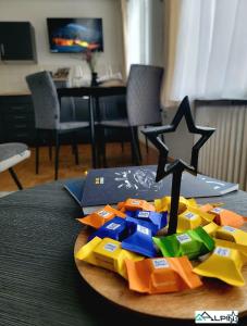 a plate with a star on top of a table at Ferienwohnung Alpinstar - inklusive Oberstaufen Plus in Oberstaufen +11 photos