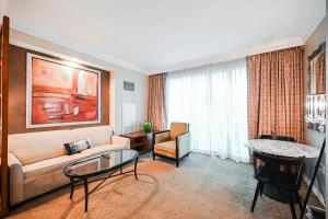 a living room with a couch and a table at Signature Rental by Owner Direct in Las Vegas