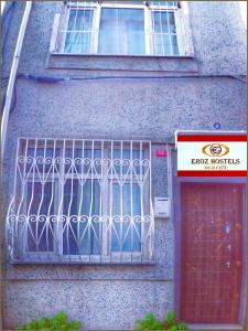 a building with a gate on the side of it at Eroz Hostel Old City in Istanbul