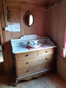 a dresser with a plate on top of it at Alphütte Chilchschwand - b48558 in Stalden