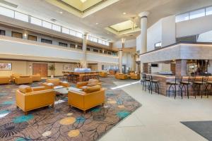 a lobby with couches and chairs and a bar at Best Western Plus El Paso Airport Hotel & Conference Center in El Paso