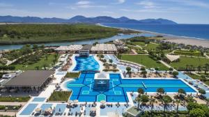 an aerial view of the resort with the ocean in the background at Hilton Dalaman Sarigerme Resort & Golf in Dalaman