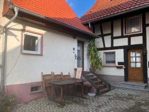 a table and chairs outside of a house at Ferienhaus im Städtle in Müllheim