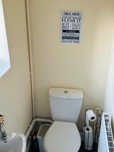 a bathroom with a toilet and a sink at Your Staycation in Bristol