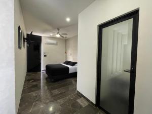 Postel nebo postele na pokoji v ubytování Hotel Suites La Negra