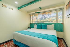 Postel nebo postele na pokoji v ubytování Hotel Casa Antigua