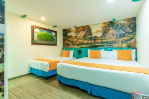Postel nebo postele na pokoji v ubytování Hotel Casa Antigua