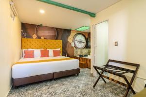 Postel nebo postele na pokoji v ubytování Hotel Casa Antigua
