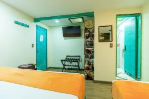 TV a/nebo společenská místnost v ubytování Hotel Casa Antigua