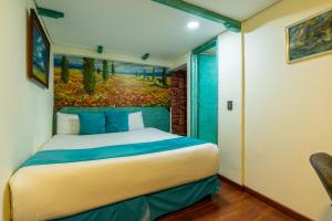 Postel nebo postele na pokoji v ubytování Hotel Casa Antigua
